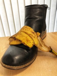 Shoe being cleaned with a banana skin
